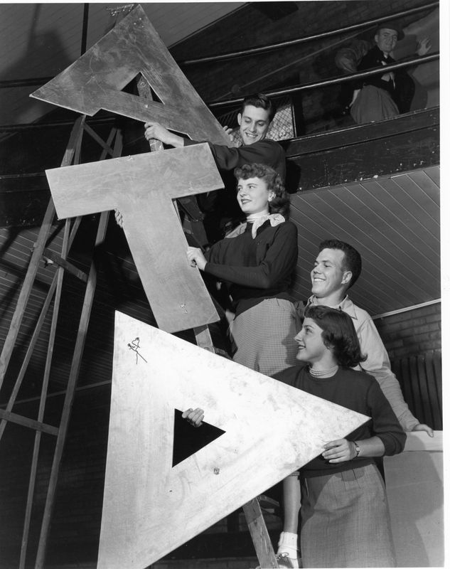 Alpha Tau Delta Students on a Ladder